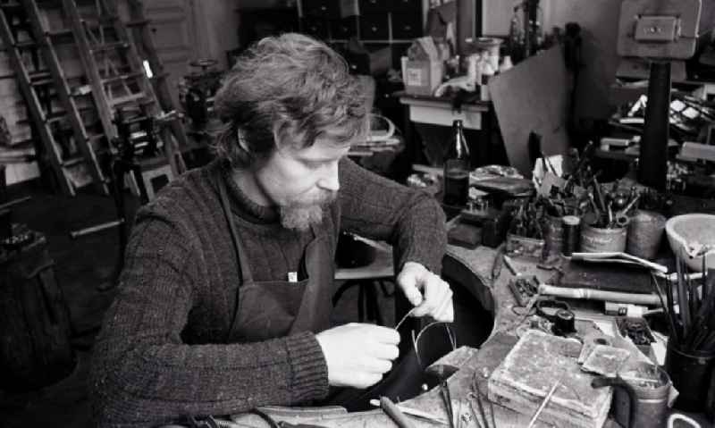 Goldsmith at work making jewelry in the district Mitte in Berlin, the former capital of the GDR, German Democratic Republic