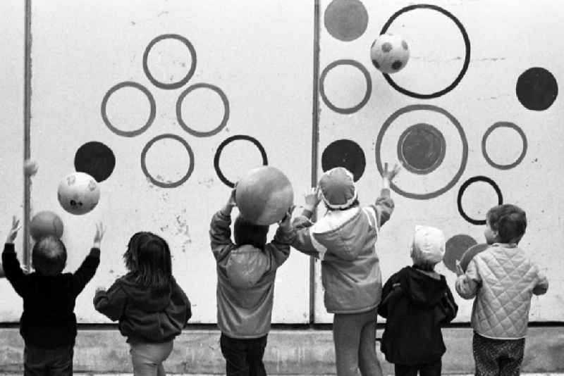 Children and young people in a playground in the district Mitte in Berlin Eastberlin, the former capital of the GDR, German Democratic Republic