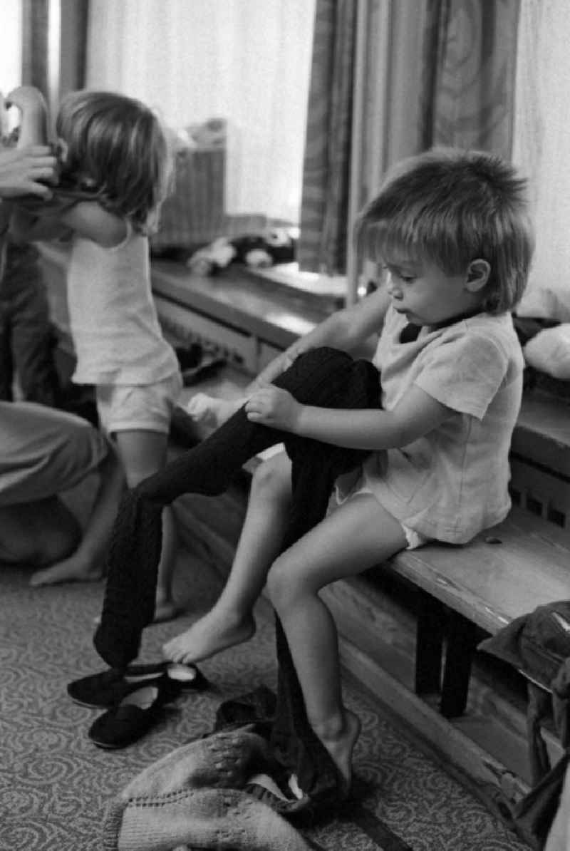 Games and fun with toddlers in kindergarten in physical education in a gym in Berlin Eastberlin on the territory of the former GDR, German Democratic Republic