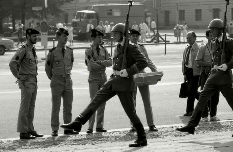 Soldiers of the Western Allied occupying power watch the Great Guard Procession in front of the Schinklelsche Wache Unter den Linden in the Mitte district of Berlin East Berlin in the territory of the former GDR, German Democratic Republic