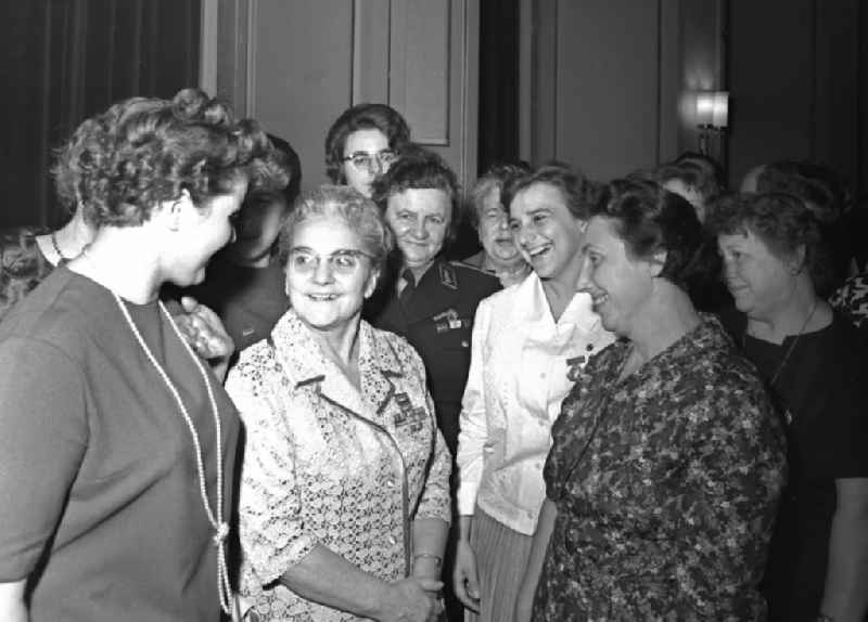 Lotte Ulbricht, wife of the GDR's Party and State leader (2nd from left), talking to women during a official reception at the GDR State Council in Berlin Eastberlin on the territory of the former GDR, German Democratic Republic