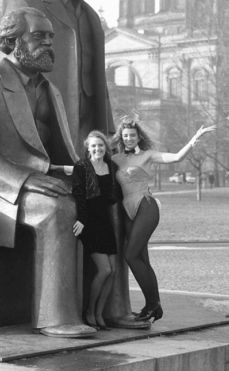As a young woman, Anja Kossak presents the latest women's fashion collection at a Playmate photo shoot in front of the statue of the Marx-Engels-Forum on Karl-Liebknecht-Strasse in the Mitte district of East Berlin in the area of the former GDR, German Democratic Republic