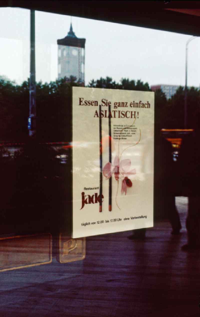 Poster in a window of the Restaurant Jade in the Palace of the Republic in the Mitte district of Berlin in the territory of the former GDR, German Democratic Republic. ' Eat simply ASIAN ! ' is the advertisement on the poster