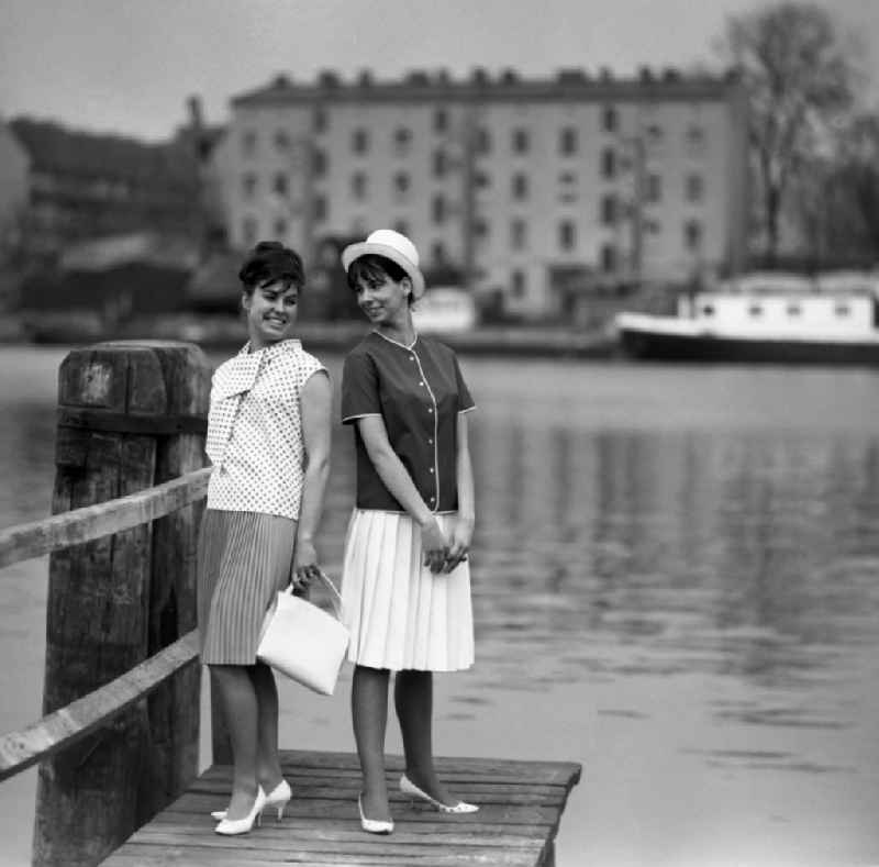 Young women present the latest summer fashion in Eastberlin on the territory of the former GDR, German Democratic Republic. Sabine Bergmann-Pohl on the right