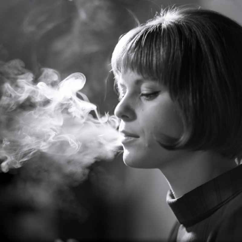 Portrait Karin Reif, actress smoking, in Eastberlin on the territory of the former GDR, German Democratic Republic
