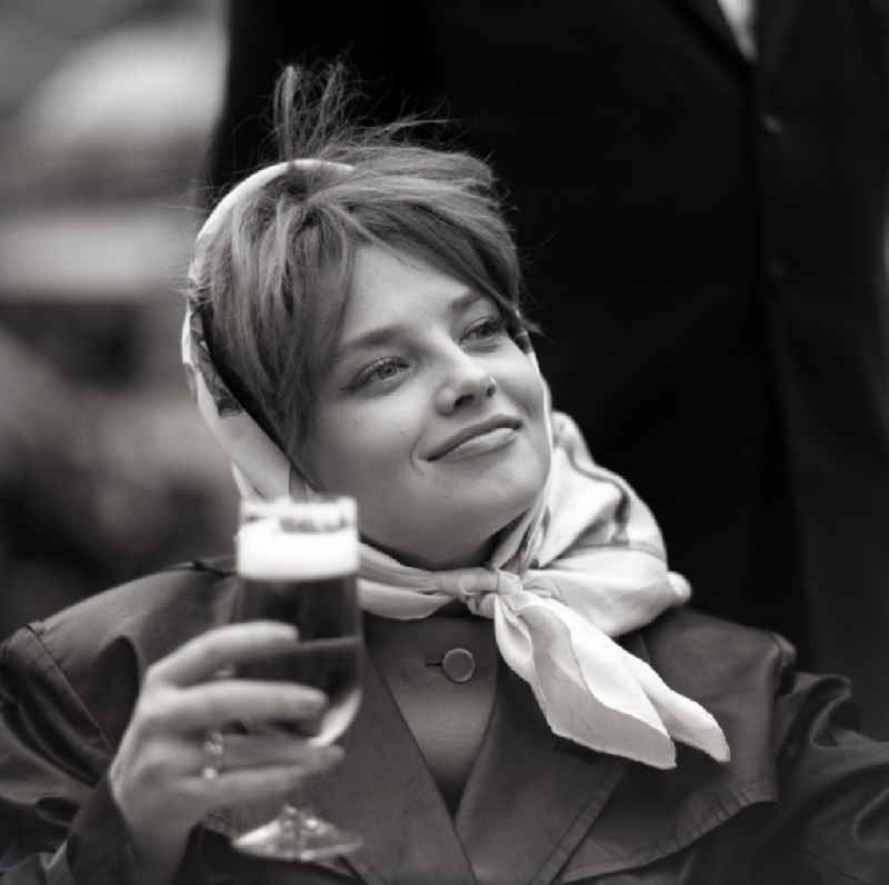 Portrait Eva-Maria Hagen, actress holds a glass of beer in her hand, in Eastberlin on the territory of the former GDR, German Democratic Republic