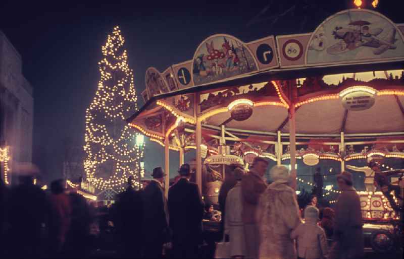 Traditional Christmas market as a special experience area for children and young people at the end of the year on street Koppenstrasse - Lebuser Strasse in the district Friedrichshain in Berlin Eastberlin on the territory of the former GDR, German Democratic Republic
