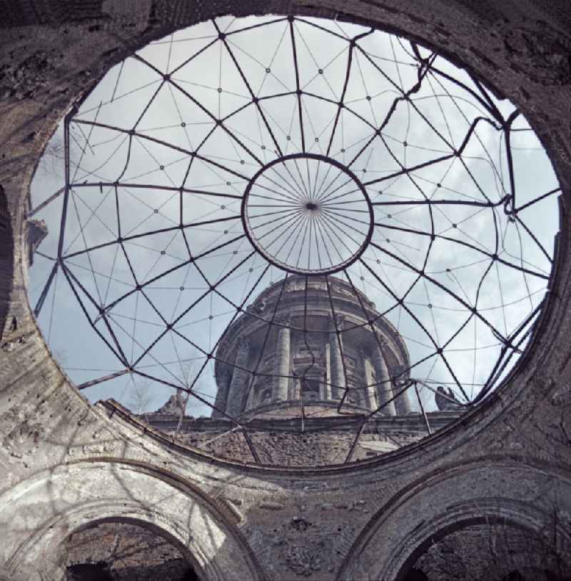 Cathedral - facade and roof of the sacred building and dome skeleton of the ruins of the 'German Cathedral' in the Mitte district of Berlin East Berlin in the area of ??the former GDR, German Democratic Republic