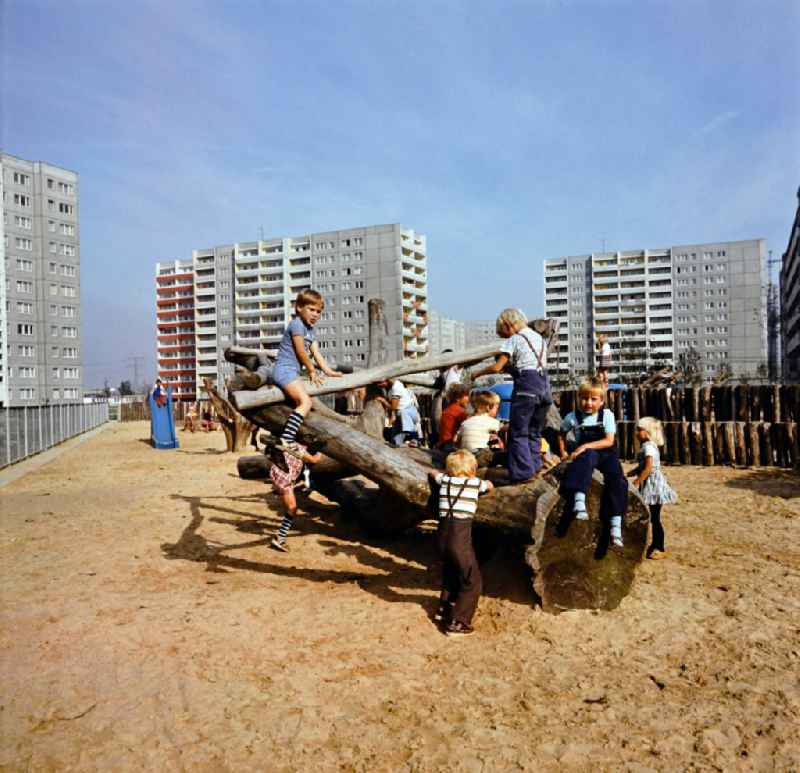 Children play on a playground in the Marzahn residential area in Berlin Eastberlin on the territory of the former GDR, German Democratic Republic
