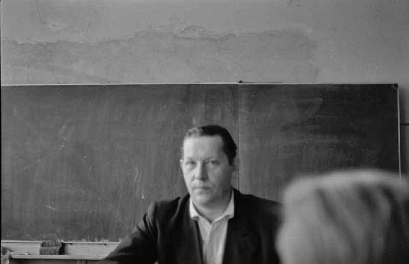 Teaching students in ain a classroom on street Jessnerstrasse in the district Friedrichshain in Berlin Eastberlin on the territory of the former GDR, German Democratic Republic