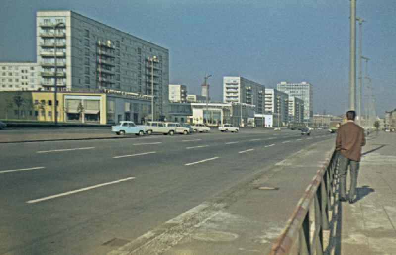 Pedestrians and passers-by in traffic in der Karl-Marx-Allee in the district Friedrichshain in Berlin Eastberlin on the territory of the former GDR, German Democratic Republic