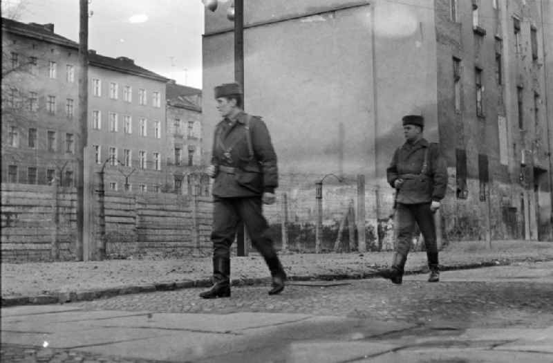 Border security fortifications with patrolling soldiers on street Bernauer Strasse in the district Mitte in Berlin Eastberlin on the territory of the former GDR, German Democratic Republic
