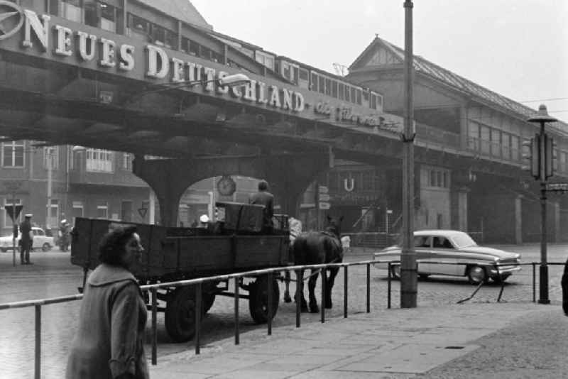 Horses in front of a team - cart on the viaduct of the Dimitroffstrasse subway station on the Schoenhauser Allee street in the Prenzlauer Berg district in Berlin East Berlin in the area of ??the former GDR, German Democratic Republic
