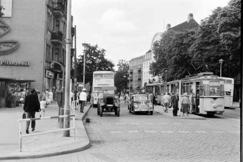 Tram train of the series Typ T 24 E and double-decker bus Do56 at Garbatyplatz - Berliner Strasse in the Pankow district in Berlin East Berlin on the territory of the former GDR, German Democratic Republic