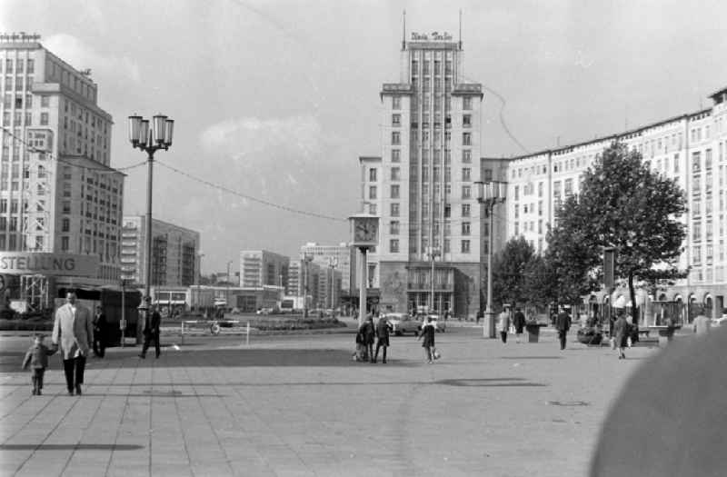 Pedestrians and passers-by in traffic on place Strausberger Platz in the district Friedrichshain in Berlin Eastberlin on the territory of the former GDR, German Democratic Republic