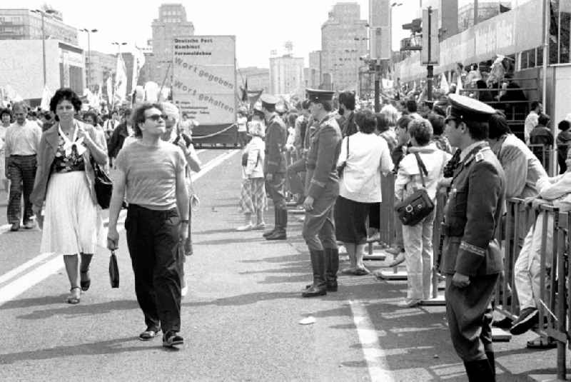 Participants of the May 1st demonstration on Karl-Marx-Allee (Stalinallee) in the city center in the Mitte district of Berlin East Berlin in the territory of the former GDR, German Democratic Republic