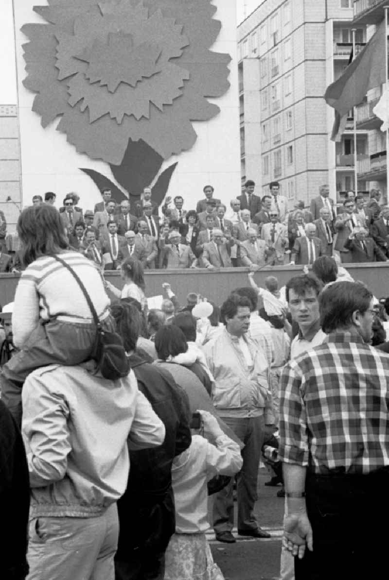 Participants from all social classes and sections of the population as a large demonstration pay homage to the members of the party and state leadership on the specially built honorary stage for May 1st on Karl-Marx-Allee (Stalinallee) in the city center in the Mitte district of Berlin in East Berlin in the area the former GDR, German Democratic Republic
