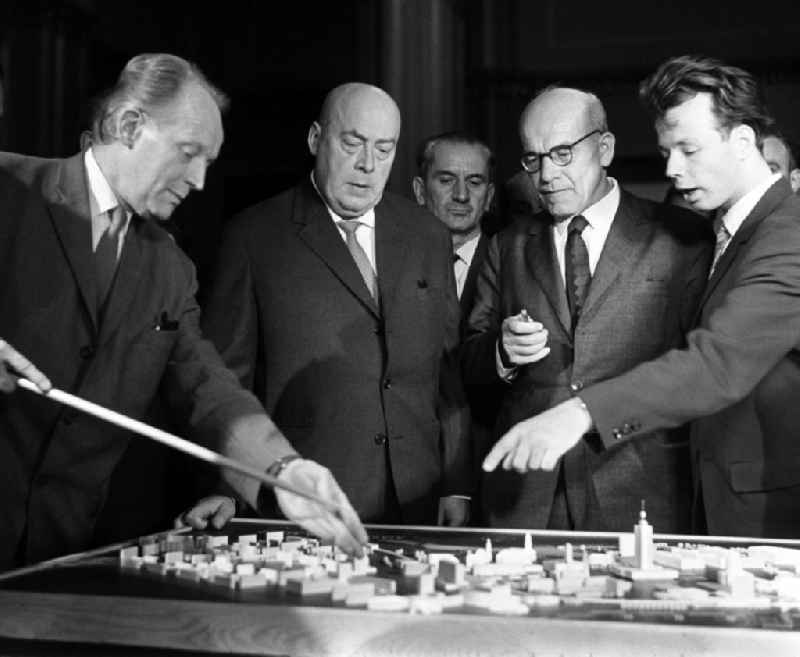 During their state visit, Jozef Cyrankiewicz (second from left) and Wladyslaw Gomulka (second from right) look at a model of the city center of Berlin, on the territory of the former GDR, German Democratic Republic