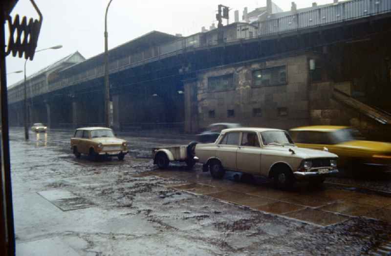 Cars drive on Schoenhauser Alle in East Berlin in Prenzlauer Berg on the territory of the former GDR, German Democratic Republic