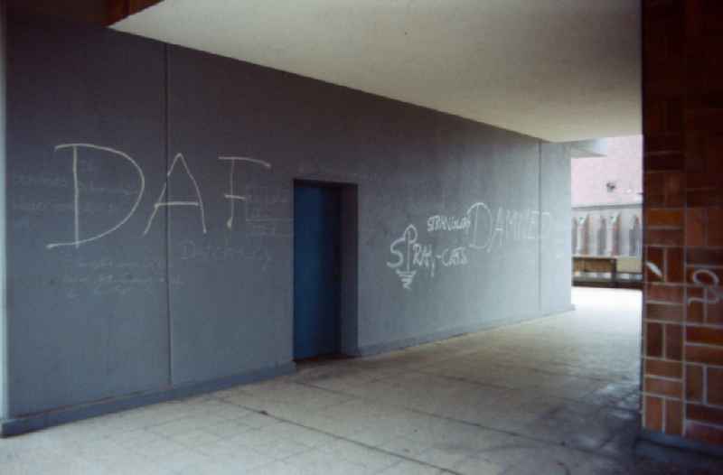 DAF and Stranglers lettering on a house wall in Berlin-Mitte in the area of the former GDR, German Democratic Republic