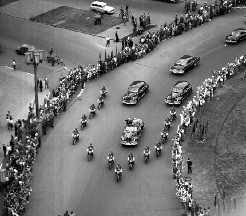 State visit of the Soviet Prime Minister Nikita Khrushchev to Berlin in the territory of the former GDR, German Democratic Republic. Nikita Khrushchev and Walter Ulbricht drive together past spectators on Strausberger PLatz along Stalinallee, now Karl-Marx-Allee