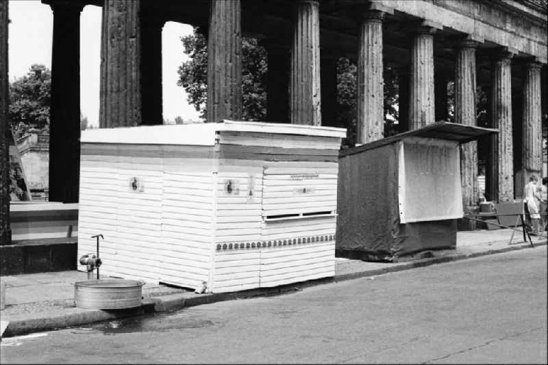 Wooden stalls at the colonnade in Berlin on the territory of the former GDR, German Democratic Republic