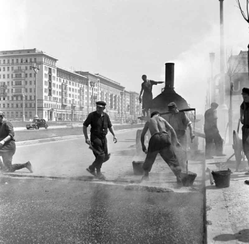 Road construction work in the newly built Stalinallee (now Karl-Marx-Allee) in the Friedrichshain district of East Berlin in the territory of the former GDR, German Democratic Republic