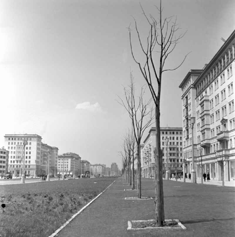 People strolling in the newly built Stalinallee (now Karl-Marx-Allee) in East Berlin in the district of Friedrichshain on the territory of the former GDR, German Democratic Republic