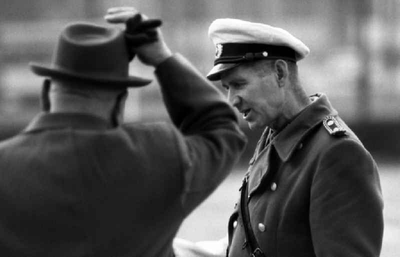 Traffic policeman speaks with a passerby in East Berlin on the territory of the former GDR, German Democratic Republic