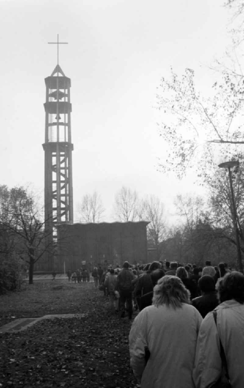 People from the Westside and the Eastside are out and about in West Berlin shortly after the fall of the Berlin Wall, here at the Kaiser Friedrich Memorial Church in Berlin-Tiergarten