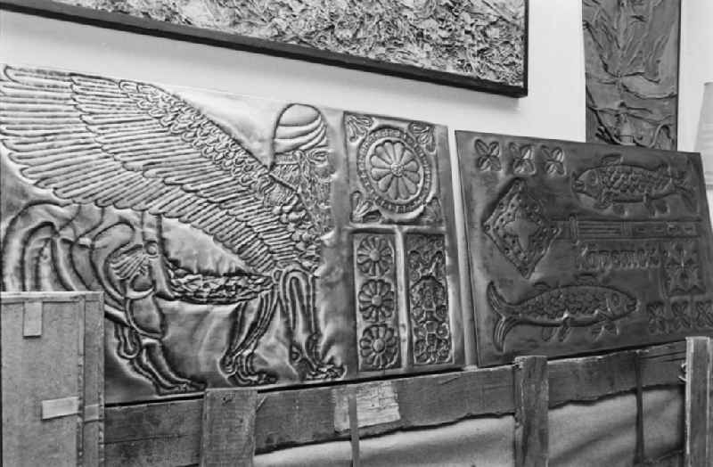 Graphic designer, stonemason and artist Robert Rehfeldt producing embossed copper reliefs for the Palasthotel in his studio in the Pankow district of East Berlin in the territory of the former GDR, German Democratic Republic