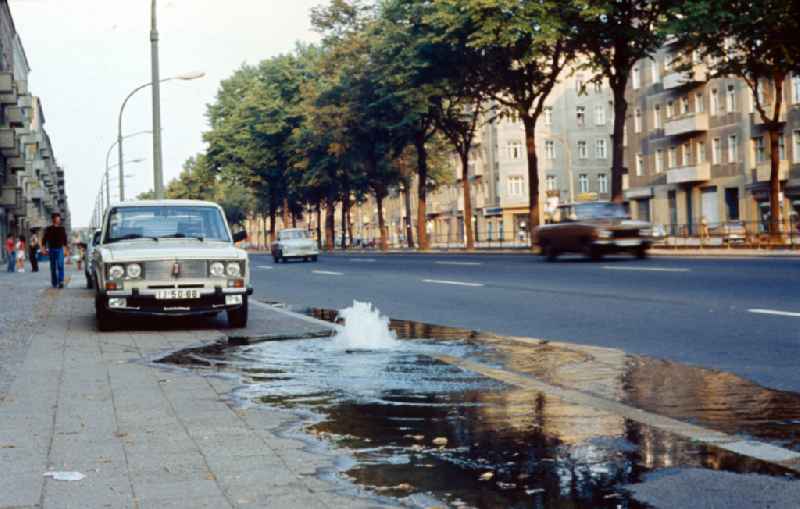 Water bubbles out of a pipe on Bornholmer Strasse in East Berlin in the territory of the former GDR, German Democratic Republic