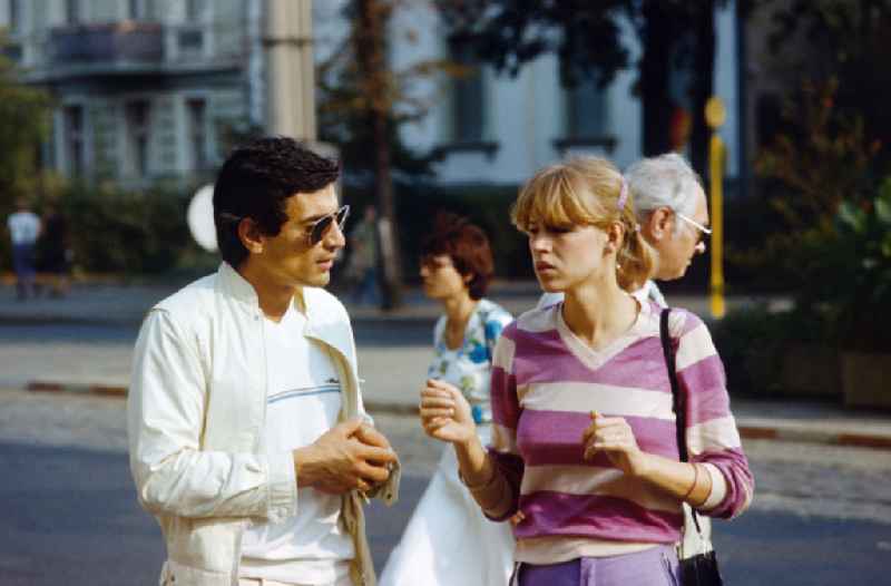 Man and woman in conversation in East Berlin on the territory of the former GDR, German Democratic Republic