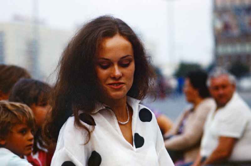 Young woman on Alexanderplatz in East Berlin in the territory of the former GDR, German Democratic Republic