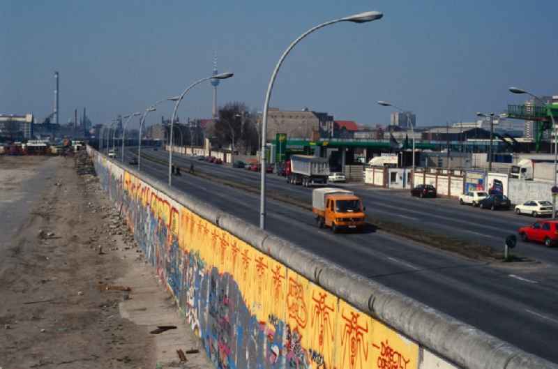 View of the Berlin Wall city inward in Berlin - Friedrichshain. The painted part of the former border installation of the GDR is located in the Stralauer Allee