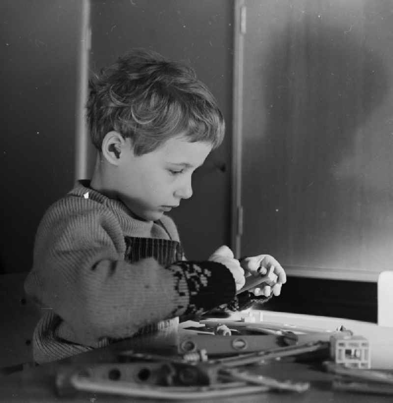 Little child in nursery school when playing with a construction kit, to promote fine motor skills, in Berlin - Friedrichshain. The nursery school children in care at the age of four and had to promote the order, the children to school readiness