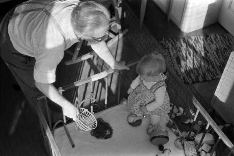 A small child with toy in playpen in Berlin - Friedrichshain