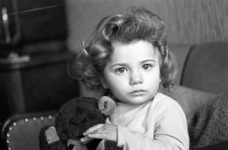 A little girl with curly hair and Teddy Bear in Berlin - Friedrichshain