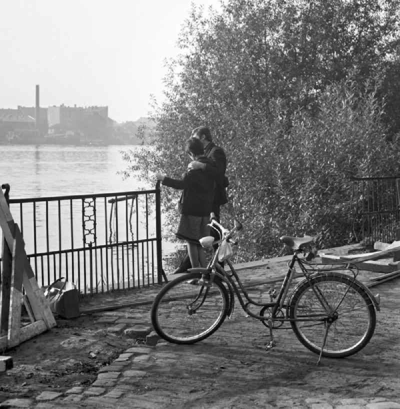 A couple in love standing on the banks of the River Spree in Berlin - Köpenick