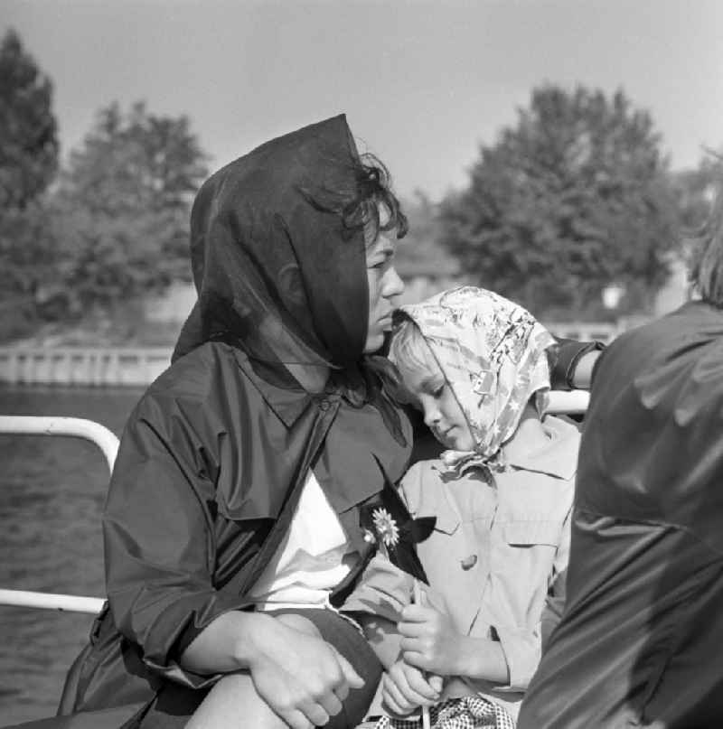 Mother with daughter on a boat trip on the river Spree in Berlin