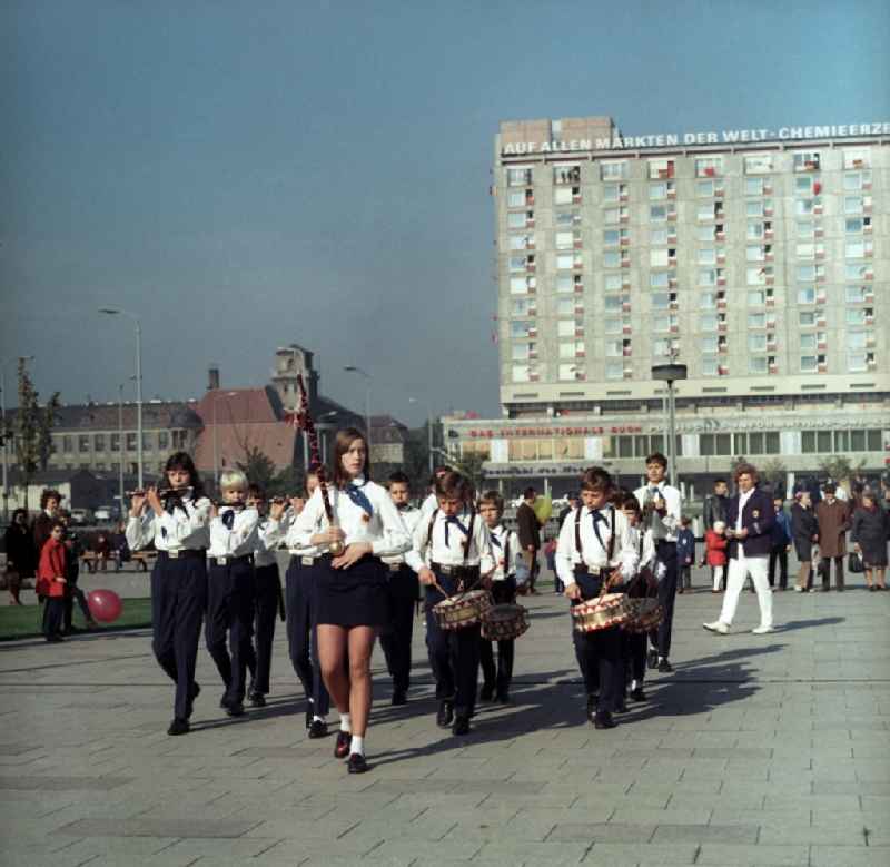 Fanfare of music corps of the Young Pioneers of the GDR pulls making music on the square between Karl-Liebknecht-Straße and Town Hall Street in the city center Mitte in Berlin