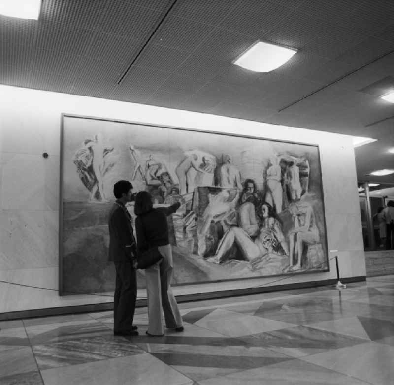 Visitors in the foyer of the Palace of the Republic in front of a painting by the artist Hans Vent in Berlin - Mitte