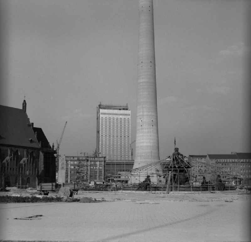 Redevelopment of the area at the foot of the television tower in Berlin - Mitte. Links St. Mary's Church, up in the background of the construction of the 'Hotel Stadt Berlin', in the center stands the base of the tower of Berlin TV tower in the foreground is the scaffolded Neptune Fountain