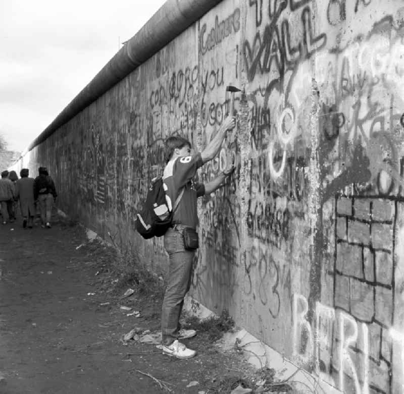 A young Wallpecker at the Berlin Wall in Berlin - Mitte. Wallpeckers was called the people who thus began on 1