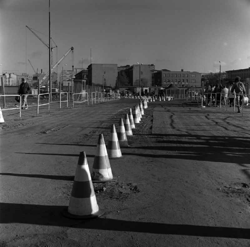 The border crossing at Potsdamer Platz in Berlin - Mitte. Provisional means of two lanes for the incipient border traffic between East Berlin and West Berlin. As a mark used traffic cones