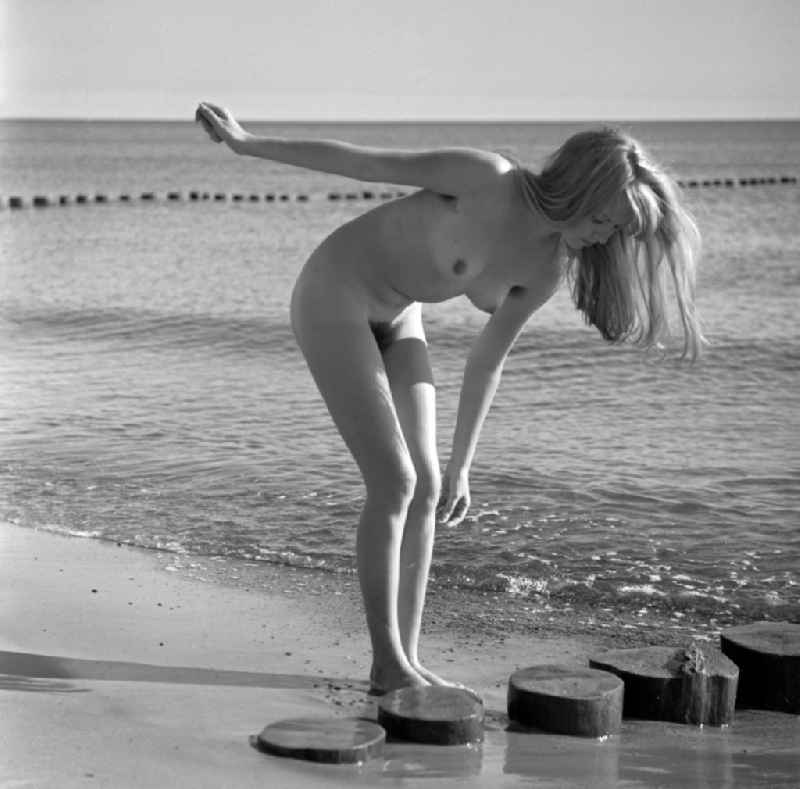 Nude of a young woman in Born am Darss in the state Mecklenburg-Western Pomerania on the territory of the former GDR, German Democratic Republic