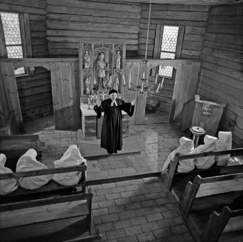 Interior of the sacred building of the churchduring a pastor's sermon to Sorbian women in mourning costumes in Boxberg/Oberlausitz, Saxony on the territory of the former GDR, German Democratic Republic