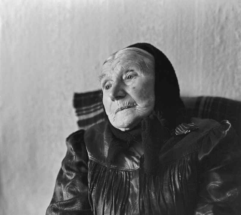 Portrait shot of an old Sorbian with a traditional headscarf in Burg (Spreewald), Brandenburg on the territory of the former GDR, German Democratic Republic