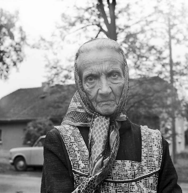 Portrait shot of an old Sorbian with a traditional headscarf in Burg (Spreewald), Brandenburg on the territory of the former GDR, German Democratic Republic