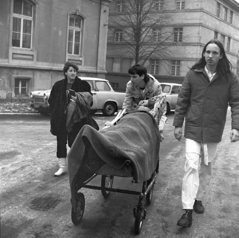 Zivildienstleistender and a nurse with a patient on a stretcher on the grounds of the Hospital Dresden-Friedrichstadt in Dresden in Saxony today